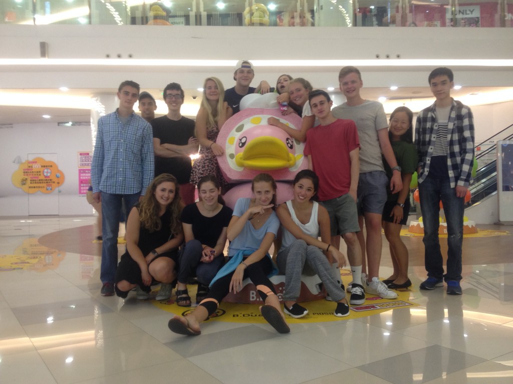 Putney in Shanghai standing around one of the many ducks in Plaza 353